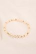 Zusss kralenarmband met tekst happy off white